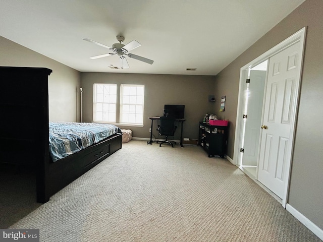 bedroom with light carpet and ceiling fan