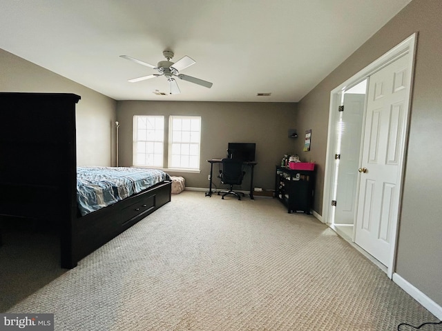 bedroom with ceiling fan and light carpet