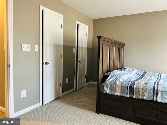 bedroom with light colored carpet