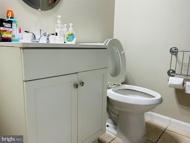 bathroom with tile patterned flooring and toilet