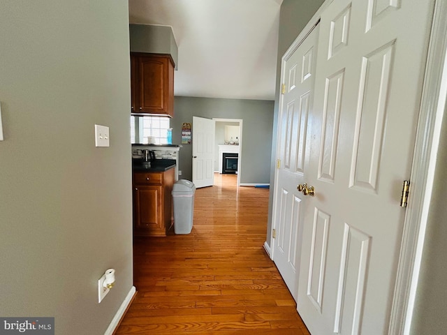 hallway with wood-type flooring