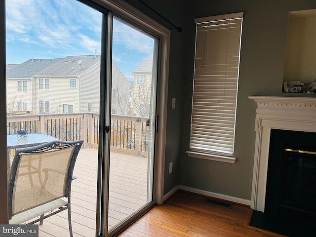 doorway to outside with light hardwood / wood-style floors