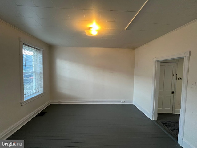 unfurnished room featuring dark wood-type flooring