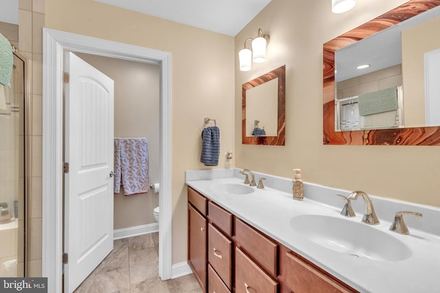 bathroom with vanity, toilet, and walk in shower