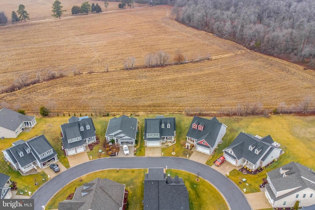 birds eye view of property with a rural view