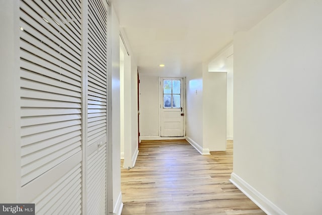 corridor featuring light wood-type flooring