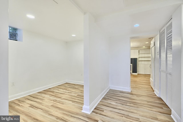 hall with light wood-type flooring