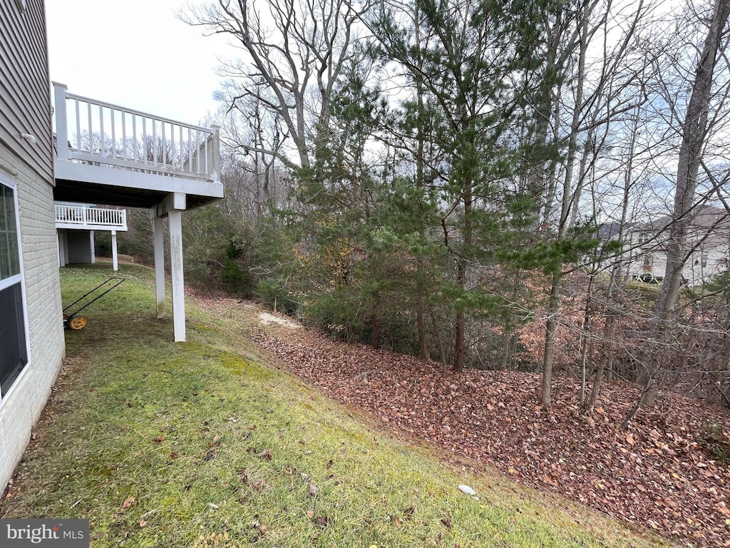 view of yard with a wooden deck