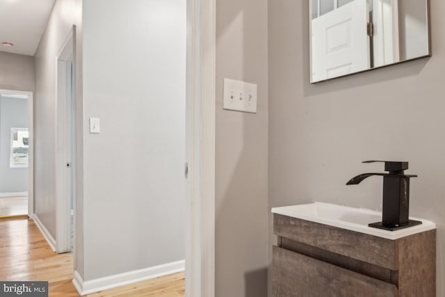 bathroom with vanity and hardwood / wood-style floors