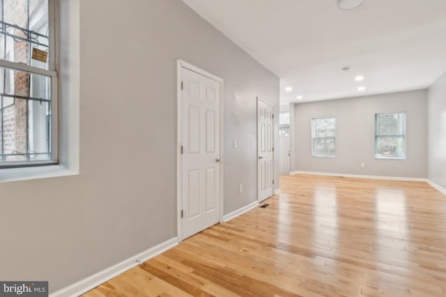 spare room with light hardwood / wood-style flooring