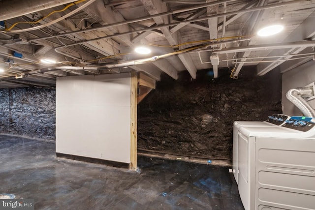 basement featuring washing machine and clothes dryer