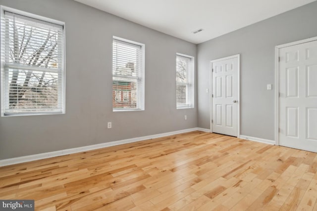 unfurnished bedroom with light hardwood / wood-style flooring