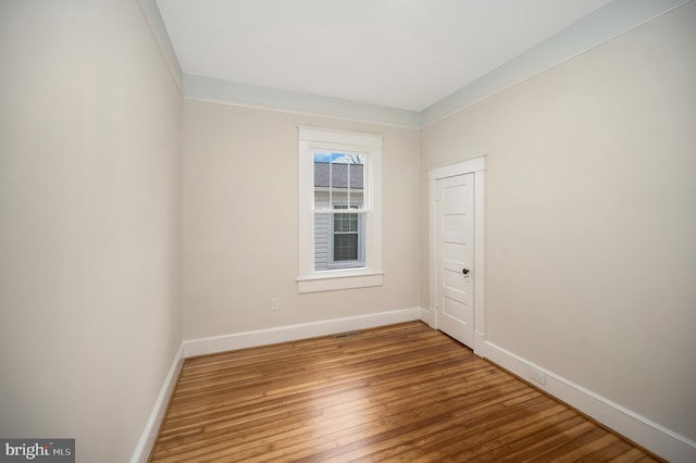 empty room with wood-type flooring