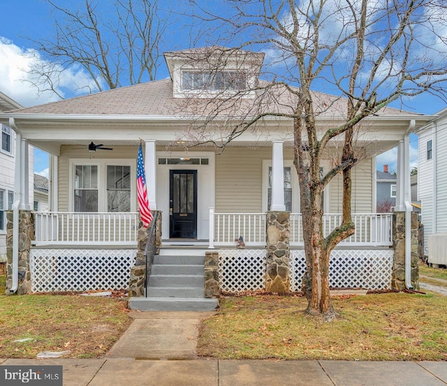 view of front of property featuring ceiling fan and covered porch