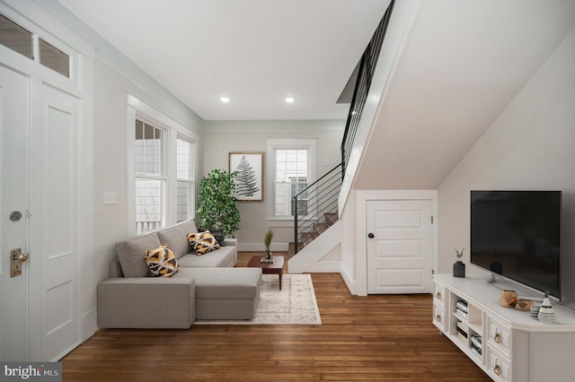 living room featuring dark wood-type flooring