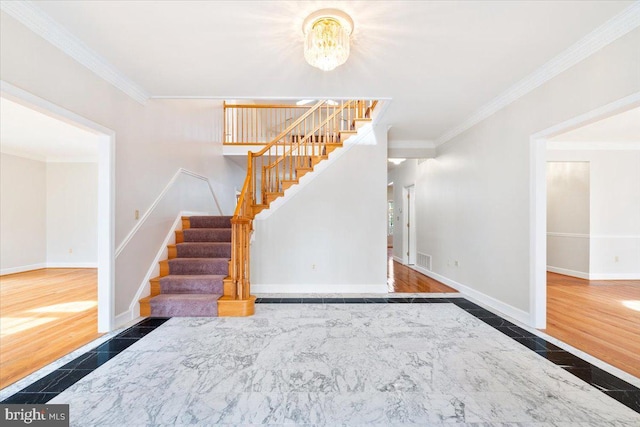 interior space with crown molding, stairway, and baseboards