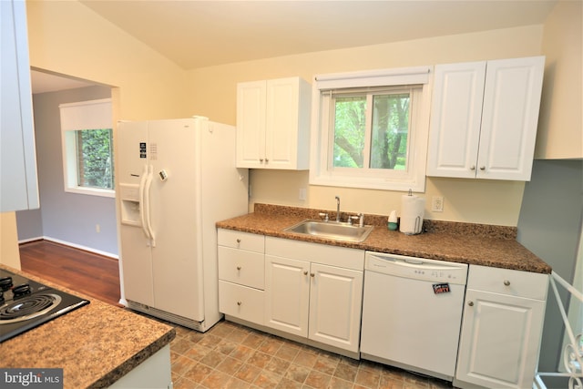 kitchen featuring white cabinetry, white appliances, plenty of natural light, and sink