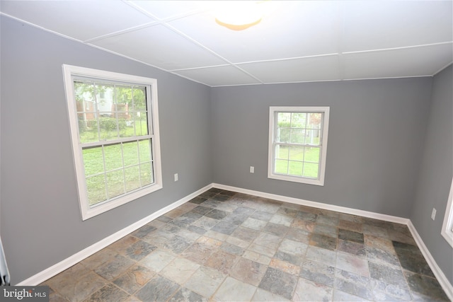 empty room with lofted ceiling