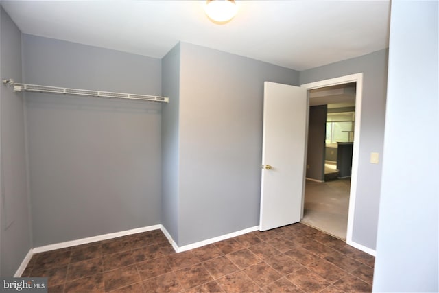 unfurnished bedroom with a closet