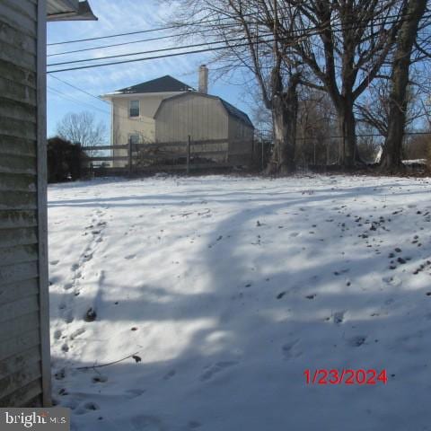 view of yard covered in snow