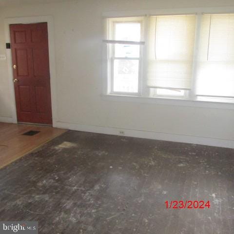 empty room featuring wood-type flooring