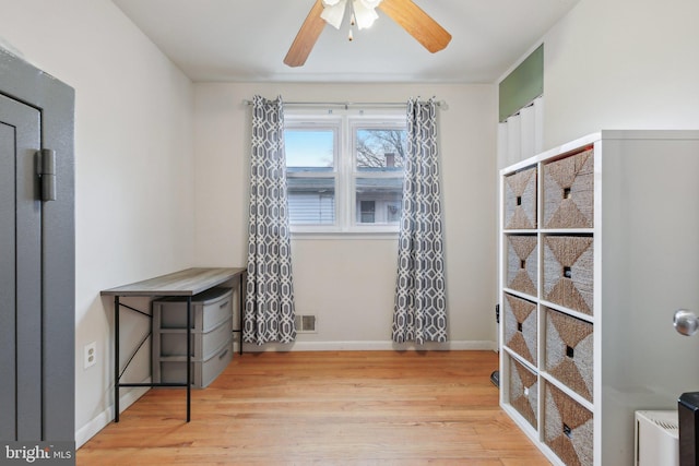 empty room with hardwood / wood-style floors and ceiling fan