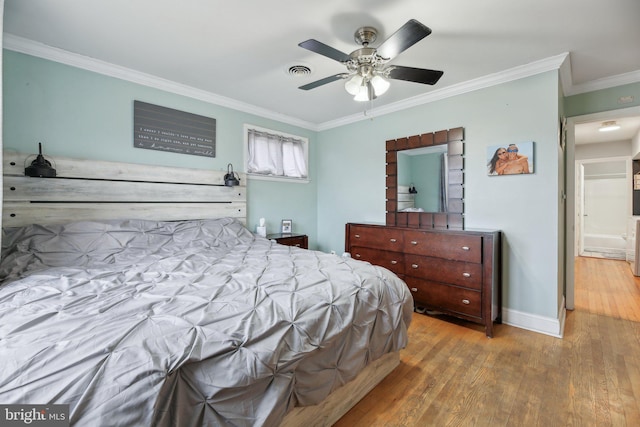 bedroom featuring crown molding, hardwood / wood-style floors, and ceiling fan