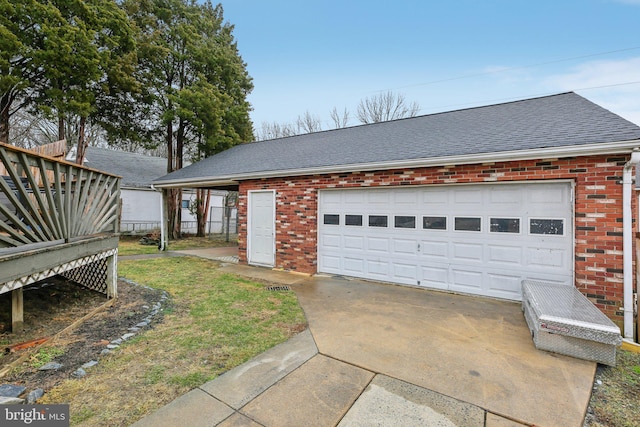 garage featuring a yard