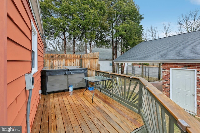 deck featuring a hot tub