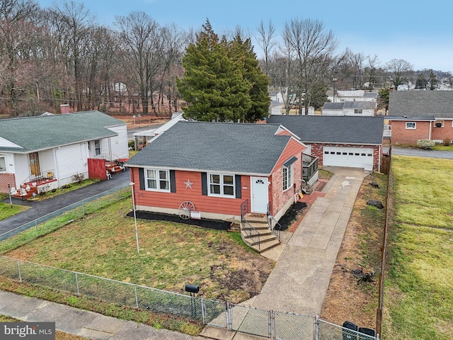 view of front of home with a garage and a front lawn