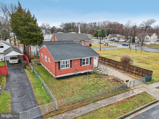 exterior space featuring a carport and a yard