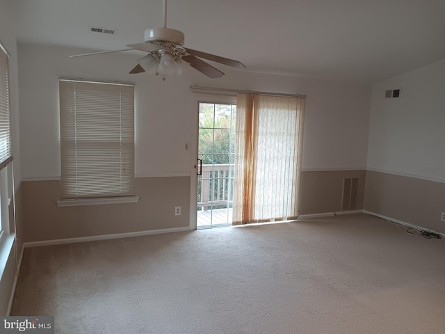 spare room with carpet floors and ceiling fan