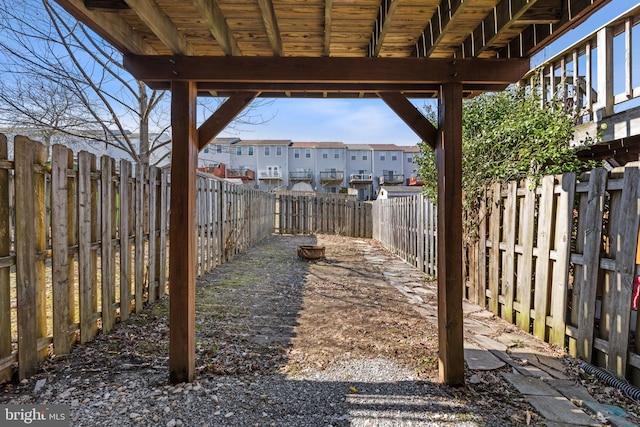 view of yard with a fenced backyard and a residential view