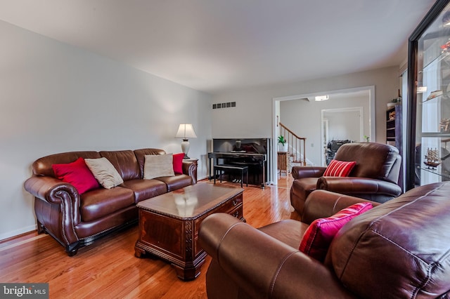 living room with light hardwood / wood-style flooring