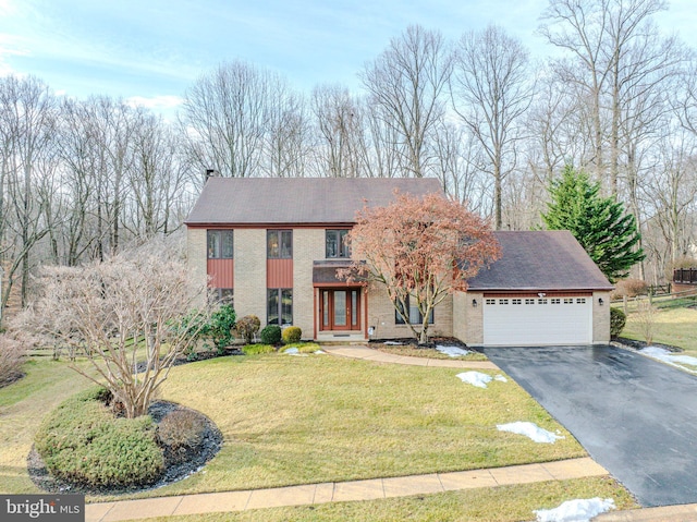 view of front facade featuring a garage and a front lawn