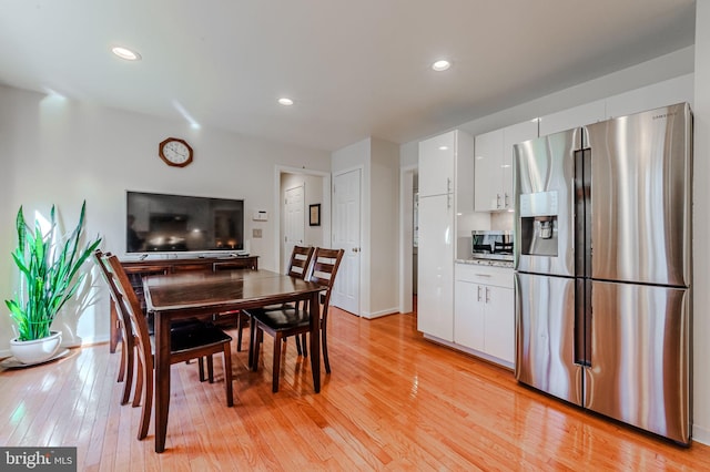 dining space featuring light hardwood / wood-style flooring