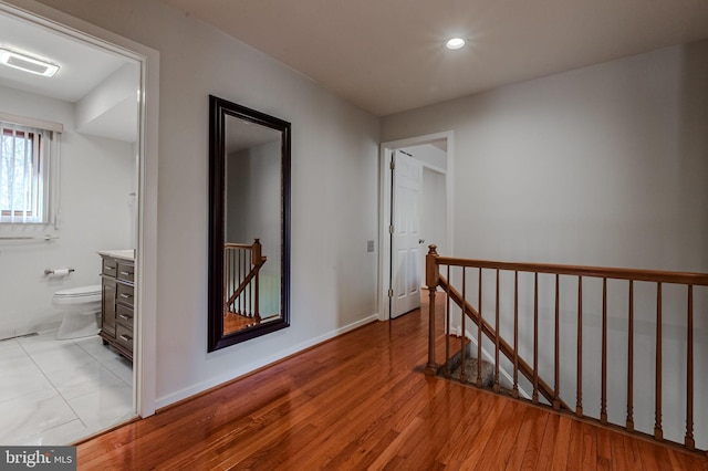 hall with light hardwood / wood-style flooring