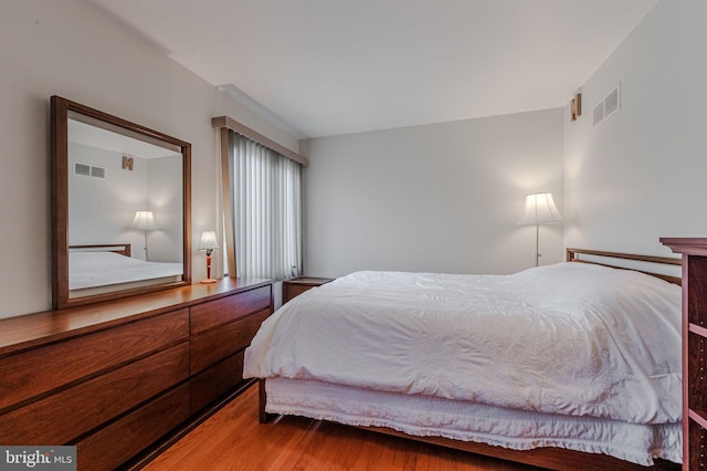 bedroom featuring hardwood / wood-style floors