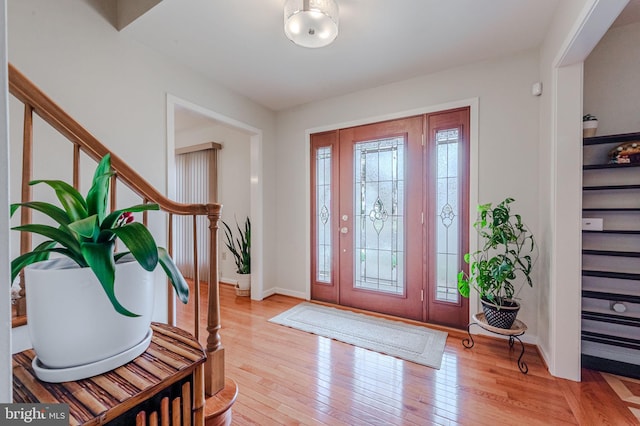 foyer entrance with light hardwood / wood-style flooring