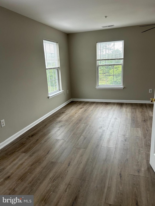 empty room featuring dark hardwood / wood-style floors