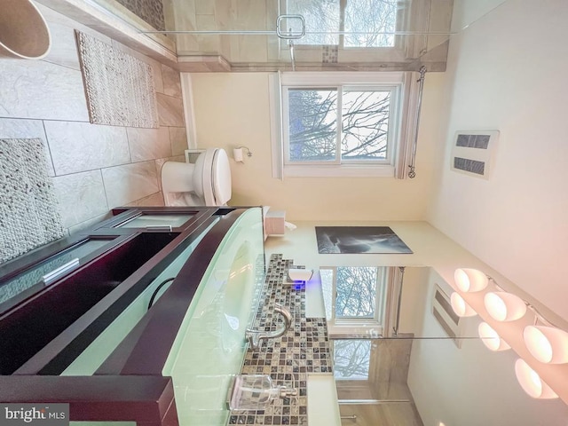 bathroom with tasteful backsplash