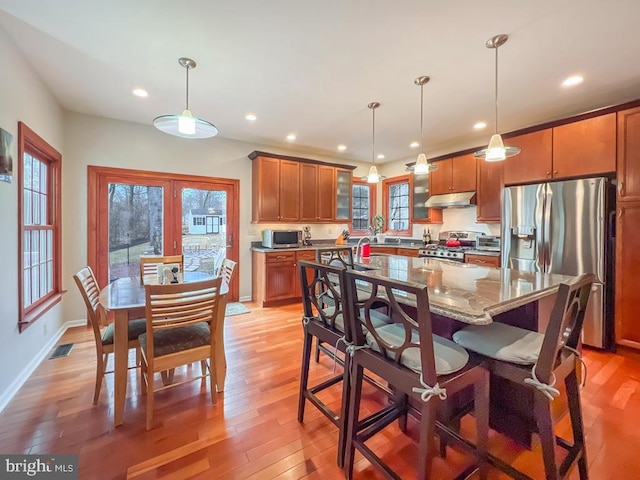 dining room featuring light hardwood / wood-style flooring