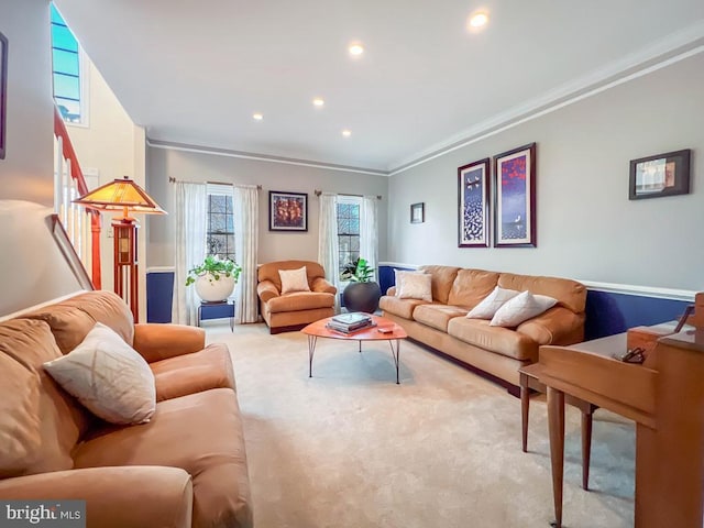 carpeted living room featuring crown molding