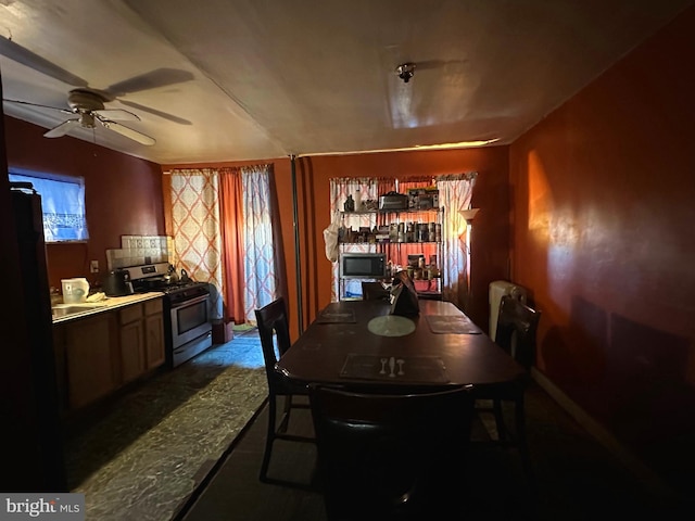 dining space featuring ceiling fan