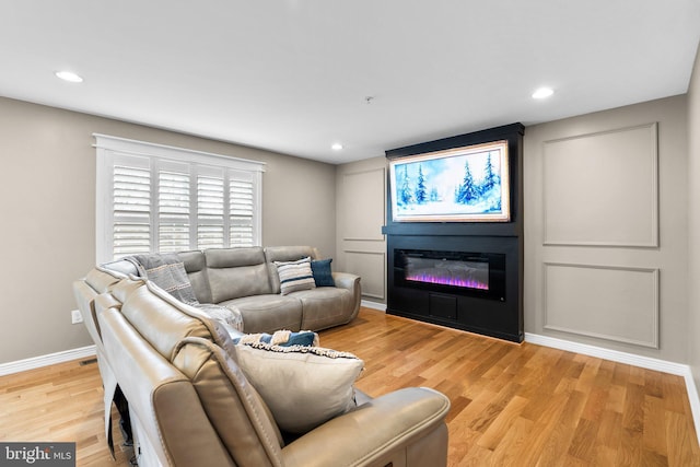 living room with light hardwood / wood-style flooring