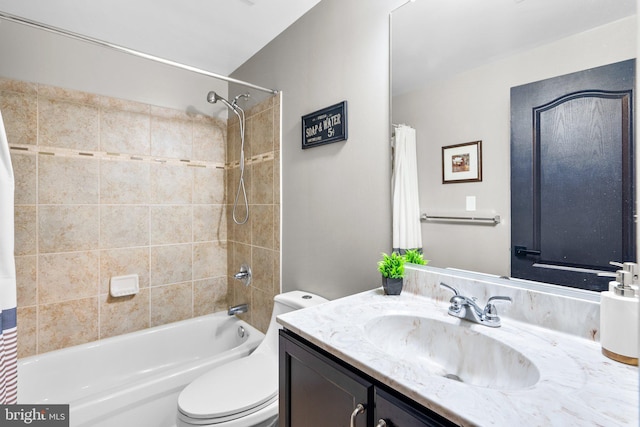 full bathroom featuring toilet, shower / bath combo with shower curtain, and vanity