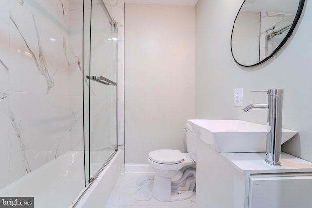 full bathroom featuring vanity, combined bath / shower with glass door, and toilet