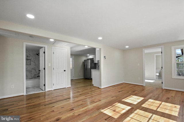 unfurnished living room featuring light wood-type flooring