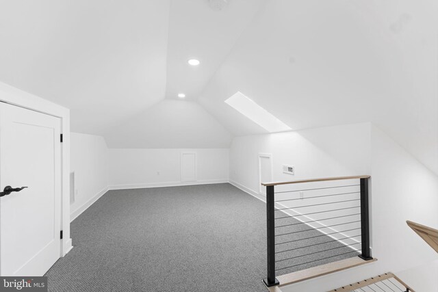 additional living space featuring baseboards, vaulted ceiling, carpet flooring, and recessed lighting