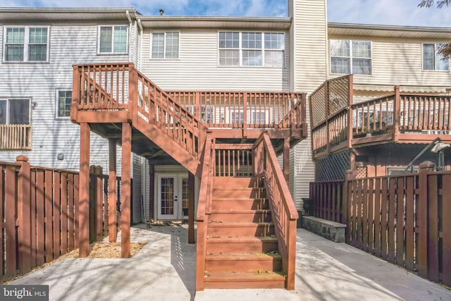 back of house with a patio area and a deck